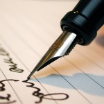 man writing a contract